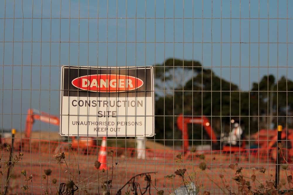 site that says warning: construction site